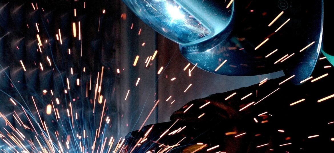 engineer welding to repair a cracked wheel that was losing air
