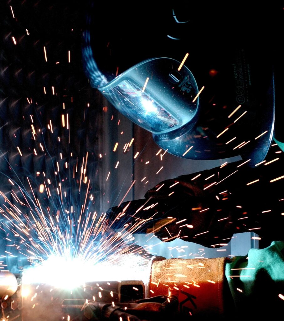 engineer welding to repair a cracked wheel that was losing air