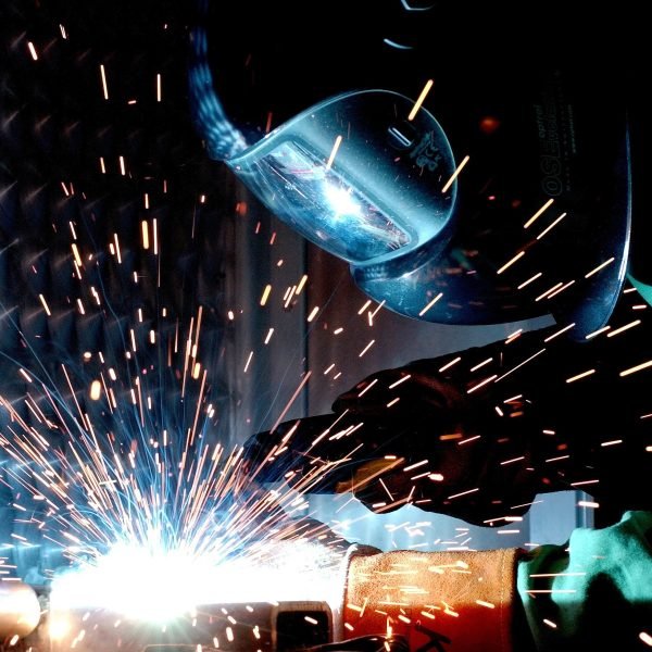 engineer welding to repair a cracked wheel that was losing air
